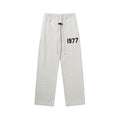 FEAR OF GOD FOG ESSENTIALS Flocked 1977 Straight‑Leg Sweatpants Men